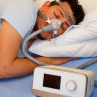 Person sleeping comfortable with CPAP machine