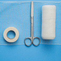 Gauze, Scissors, and Bandages Laid Flat